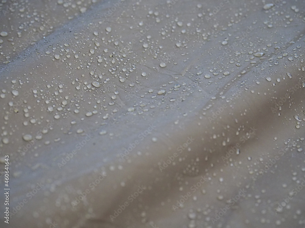 Drops of rain in the morning on a waterproof cloth Drops of rain in the morning on a waterproof cloth