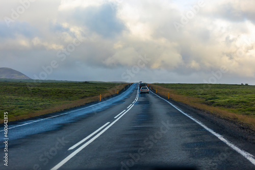 beautiful view of the Icelandic landscape covered in lush green grass and dynamic skies the inspires wanderlust in every traveler. the scenic nature view show the ecology of the countryside 