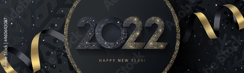 Happy New Year 2022 beautiful sparkling design of numbers on black background with texture of black snowflakes and shining falling snow. Trendy modern winter banner, poster or greeting card template