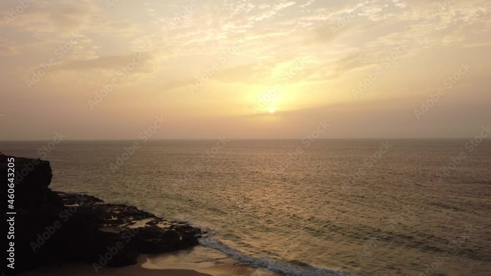 A young woman enjoying the sunset at West Coast Photo Point in the town of El Cotillo in the north of the island of Fuerteventura, Canary Islands. Spain, 4k video A young woman enjoying the sunset at West Coast Photo Point in the town of El Cotillo in the north of the island of Fuerteventura, Canary Islands. Spain, 4k video