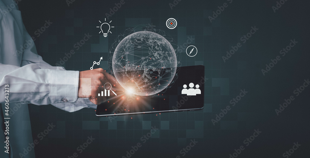 Fototapeta premium Businessman using mobile tablet on global network connection on investor and customer with sale data exchange and development of business. Financial and banking, Digital link tech, big data.