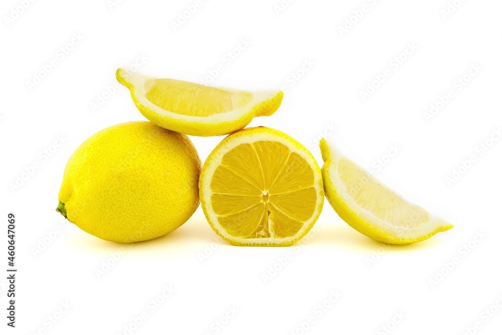Whole and sliced ripe lemon fruit on white Whole and sliced ripe lemon fruit on white