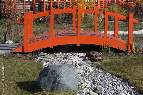 Little Japan in Kurkino district, Moscow city, Russia. Japanese garden. Japanese autumn park in Moscow with stones and plants. Architecture in asian, japanese style. Red bridge in Japanese garden photo