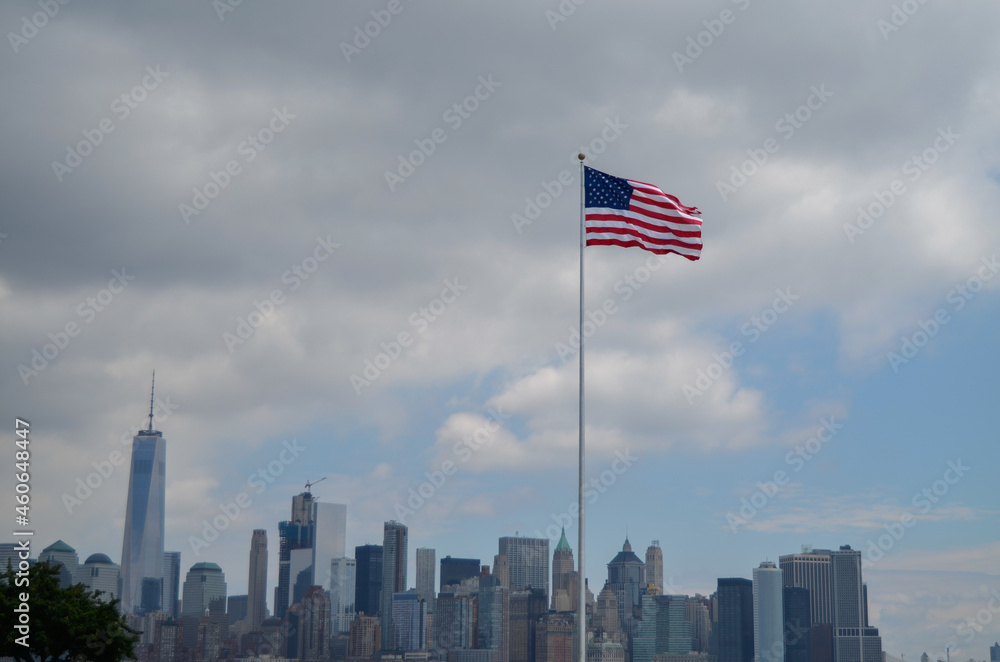 American flag and the New York Financial District skyline in the background