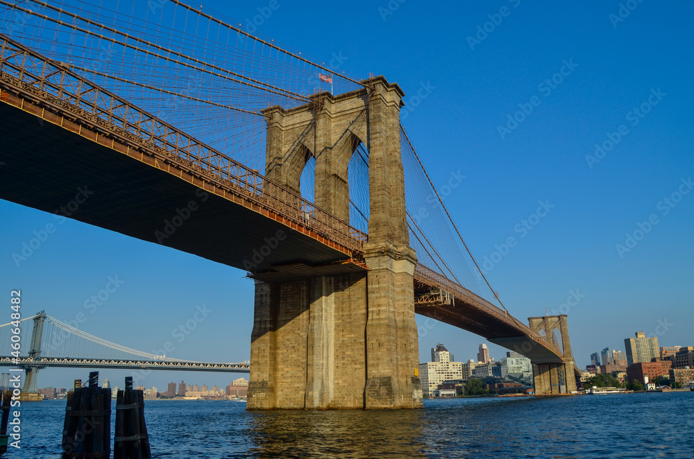 Fototapeta premium Brooklyn Bridge seen from Manhattan side with Brooklyn cityscape in the background