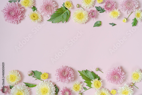 Fototapeta Naklejka Na Ścianę i Meble -  Flowers frame with copy space on pink.Greeting  floral card with chrysanthemums,  can be used as wedding invitation card.