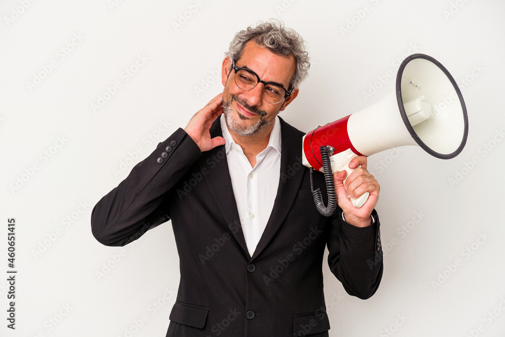 Middle age business man holding a megaphone isolated on white background touching back of head, thinking and making a choice. Middle age business man holding a megaphone isolated on white background touching back of head, thinking and making a choice.