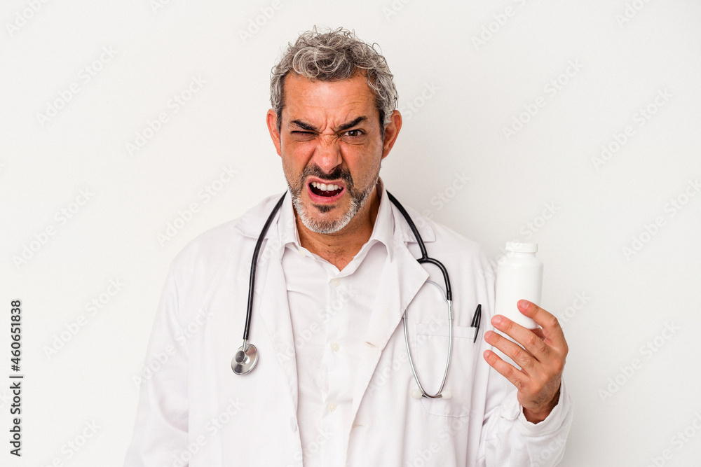 Middle age doctor caucasian man isolated on white background screaming very angry and aggressive. Middle age doctor caucasian man isolated on white background screaming very angry and aggressive.