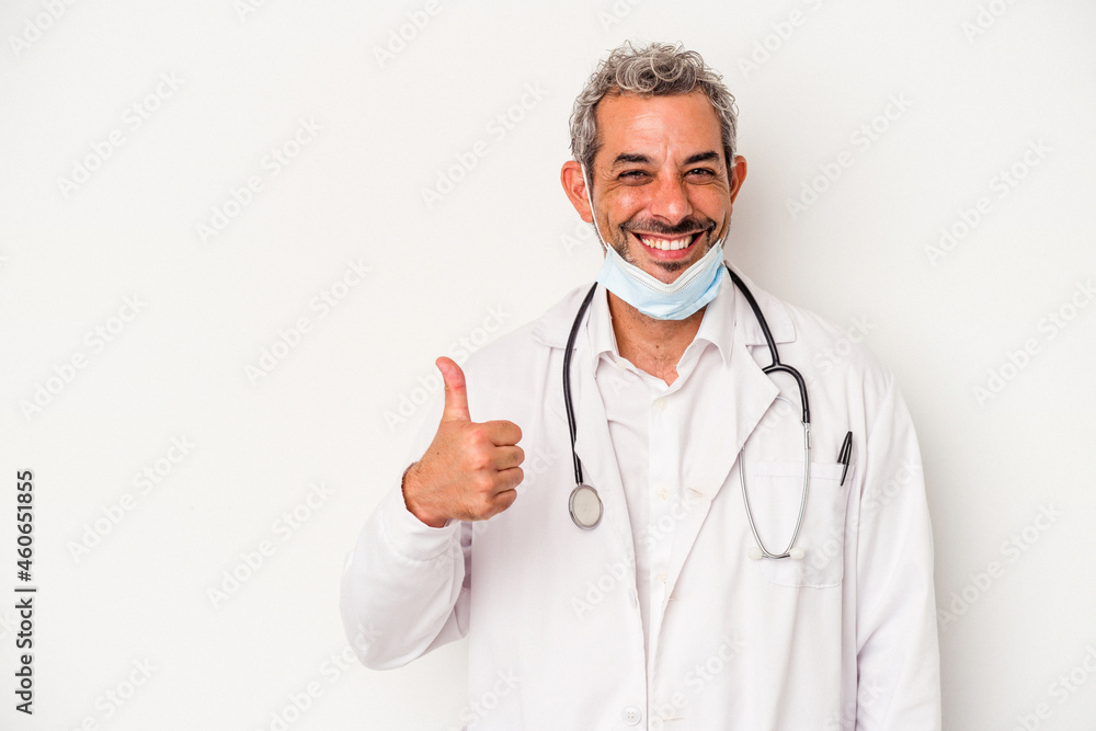 Middle age doctor man wearing a mask for virus isolated on white background smiling and raising thumb up Middle age doctor man wearing a mask for virus isolated on white background smiling and raising thumb up