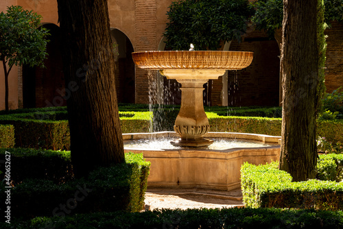 The big central marble fountain in the picturesque Daraxa's Garden (Jardines de Daraxa), part of the Nasrid palaces, Alhambra de Granada UNESCO World Heritage Site, Granada, Andalusia, Spain photo