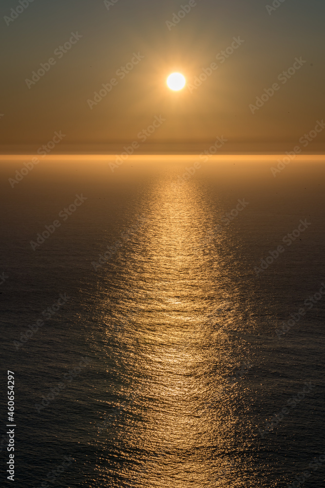 Sunset with reflection at sea.
