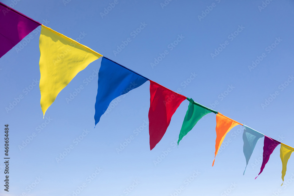 Multicolored Triangular Flags Hanging in the Sky at an Outdoor. Celebration Party. Festive mood