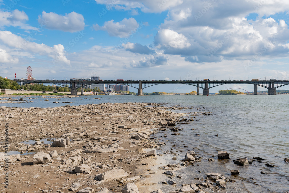 NOVOSIBIRSK, RUSSIA-11 September 2021: The Ob River in the Novosibirsk River has become shallow due to the limitation of discharges from the hydroelectric power station. 