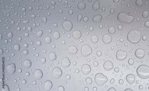 water droplets on gray metal surface