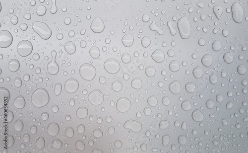 water droplets on gray metal surface