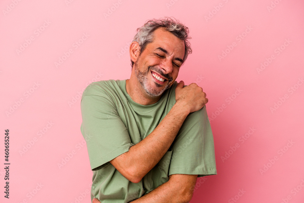 Middle age caucasian man isolated on pink background laughing and having fun. Middle age caucasian man isolated on pink background laughing and having fun.
