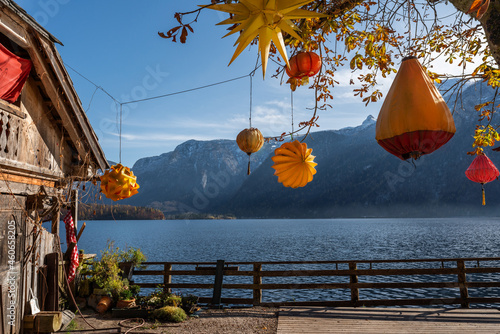 Orange lantern decorations in front of Lake Hallstatt - Hallstatt, Austria photo