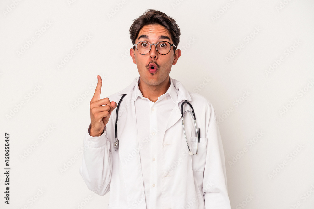 Young mixed race doctor man isolated on white background having some great idea, concept of creativity. Young mixed race doctor man isolated on white background having some great idea, concept of creativity.