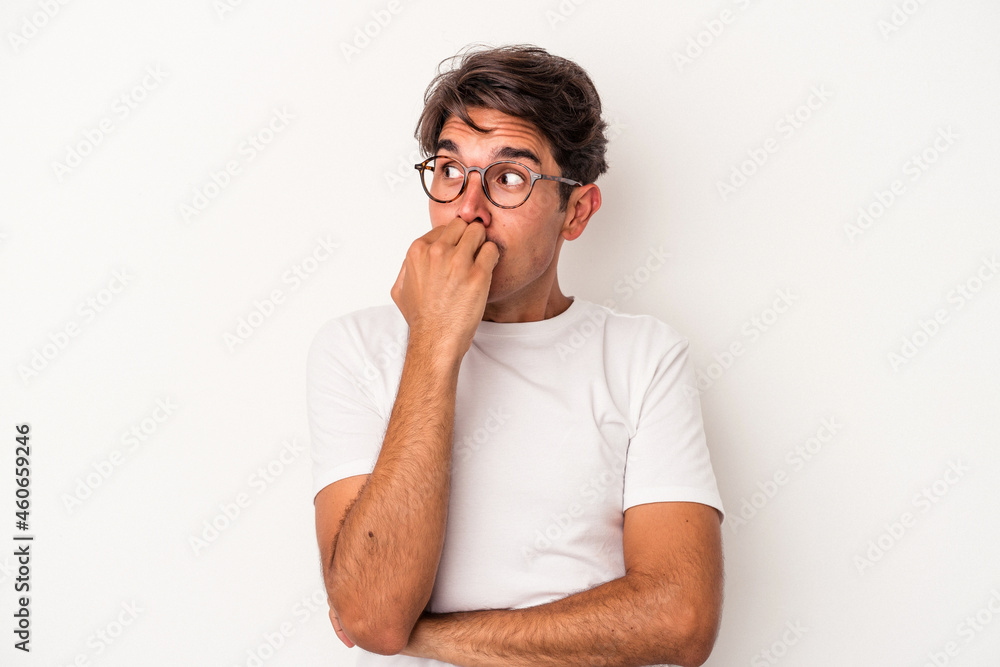 Young mixed race man isolated on white background biting fingernails, nervous and very anxious. Young mixed race man isolated on white background biting fingernails, nervous and very anxious.