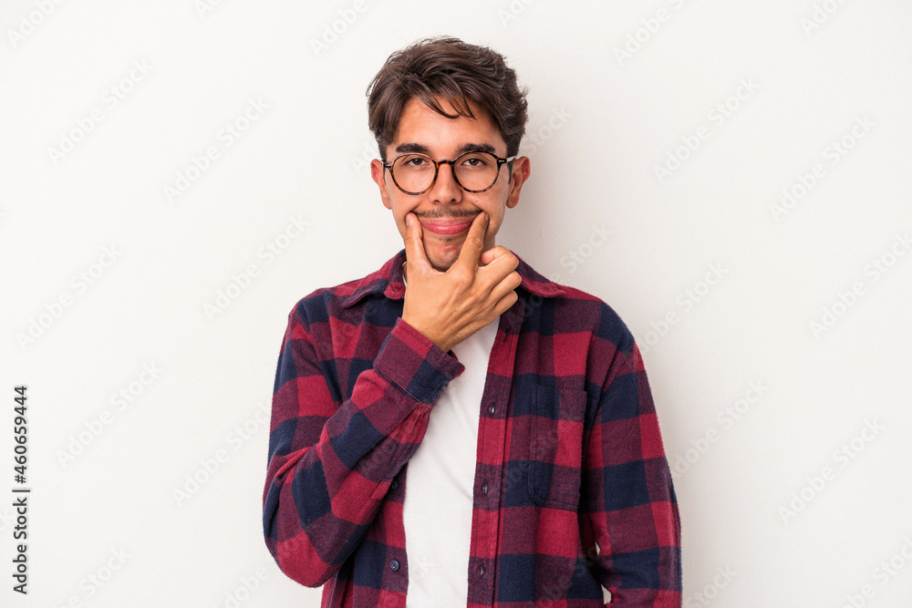 Young mixed race man isolated on white background doubting between two options. Young mixed race man isolated on white background doubting between two options.
