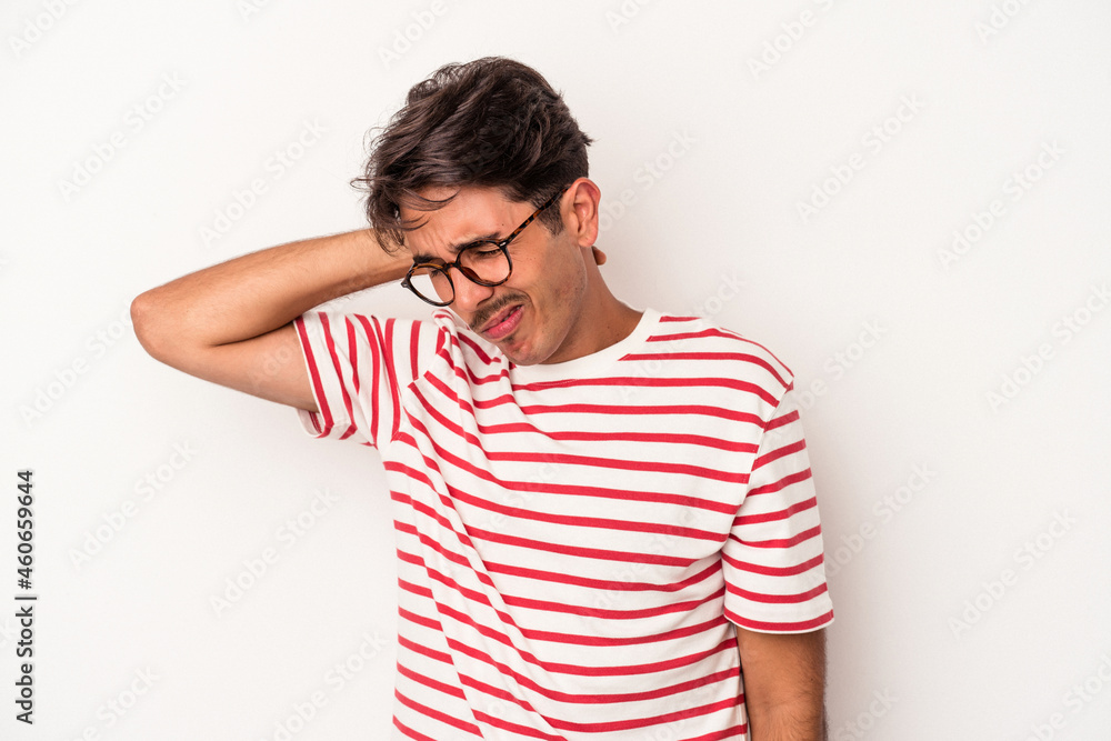 Young mixed race man isolated on white background having a neck pain due to stress, massaging and touching it with hand. Young mixed race man isolated on white background having a neck pain due to stress, massaging and touching it with hand.