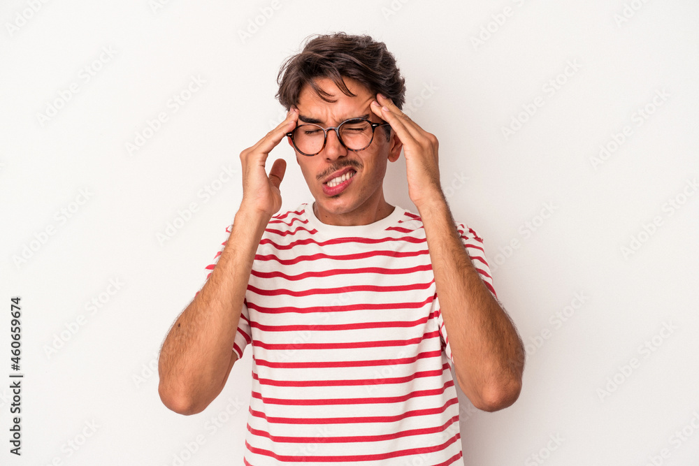 Young mixed race man isolated on white background touching temples and having headache. Young mixed race man isolated on white background touching temples and having headache.