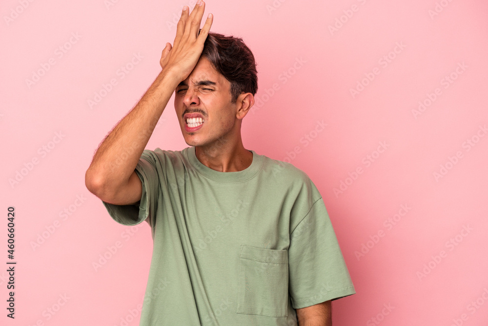Young mixed race man isolated on white background forgetting something, slapping forehead with palm and closing eyes. Young mixed race man isolated on white background forgetting something, slapping forehead with palm and closing eyes.