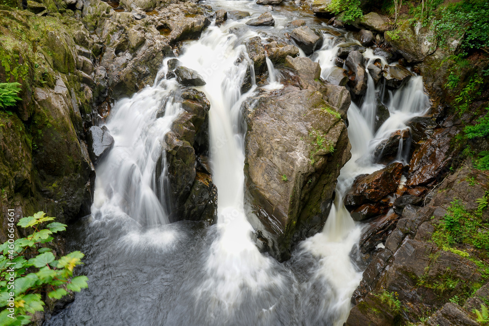 Motion blur water flowing over a waterfall in Scotland Motion blur water flowing over a waterfall in Scotland