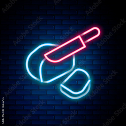 Glowing neon line Canadian peameal bacon icon isolated on brick wall background. Colorful outline concept. Vector