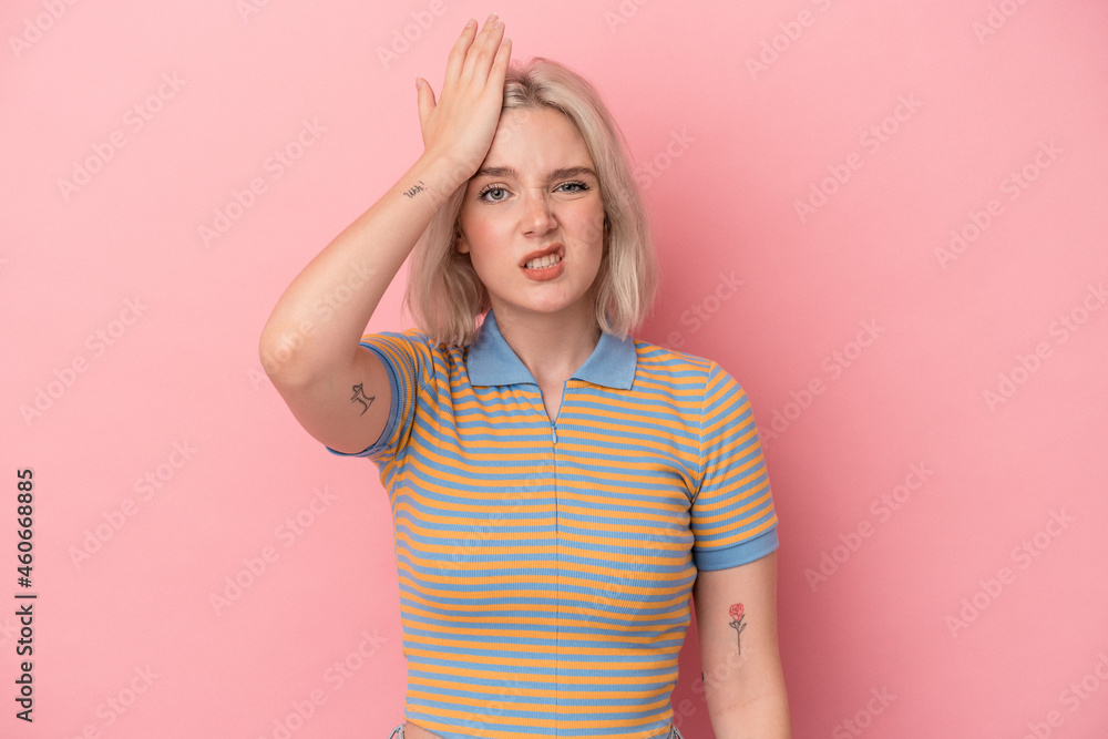 Young caucasian woman isolated on pink background forgetting something, slapping forehead with palm and closing eyes. Young caucasian woman isolated on pink background forgetting something, slapping forehead with palm and closing eyes.