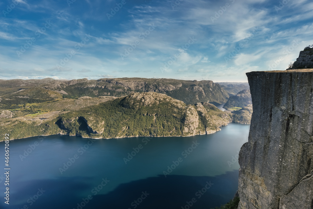 The famous and popular Preikestolen or Prekestolen (Pulpit Rock, Pulpit, Preacher's Chair), Strand, Rogaland, Norway. A steep cliff with a flat top which rises 604 metres above Lysefjorden. The famous and popular Preikestolen or Prekestolen (Pulpit Rock, Pulpit, Preacher's Chair), Strand, Rogaland, Norway. A steep cliff with a flat top which rises 604 metres above Lysefjorden.