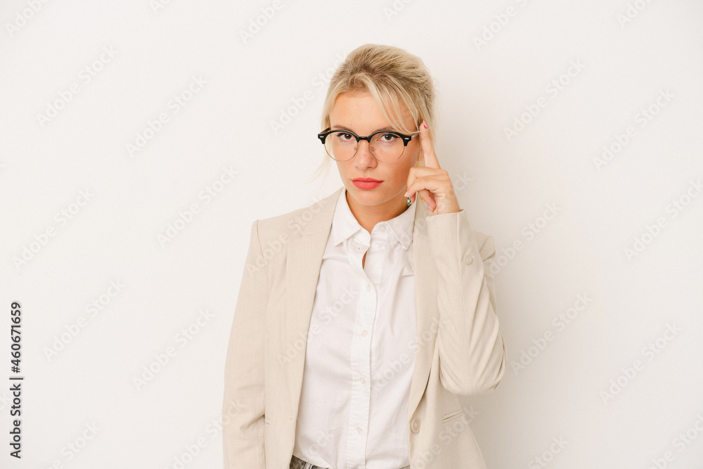 Young business Russian woman isolated on white background pointing temple with finger, thinking, focused on a task.