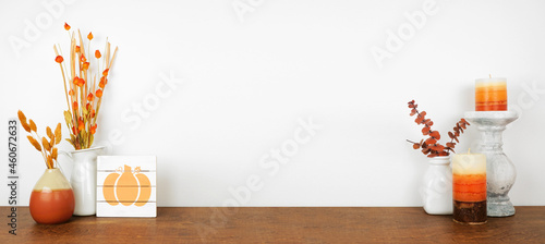 Obraz na płótnie Autumn decor on a wood shelf against a white wall banner background