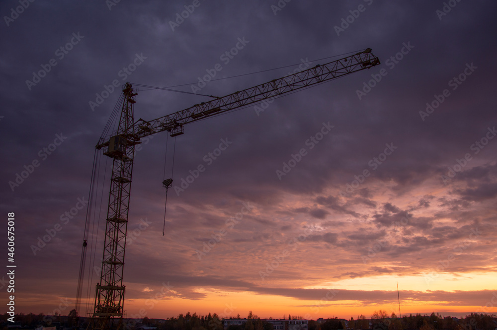 Construction site with crane at sunset Construction site with crane at sunset