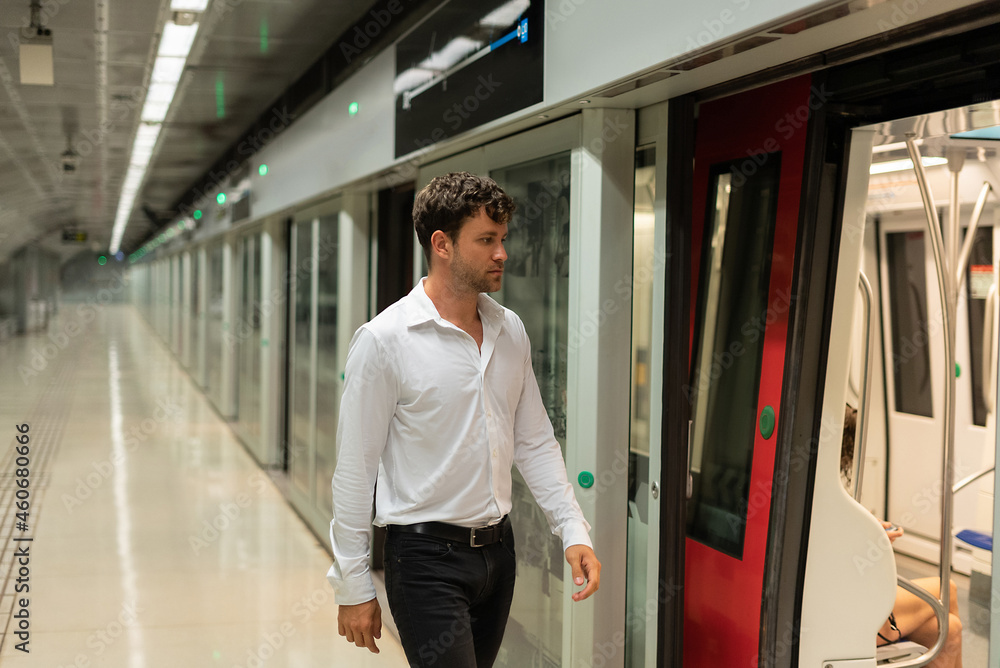 Businessman walking at underground station Businessman walking at underground station