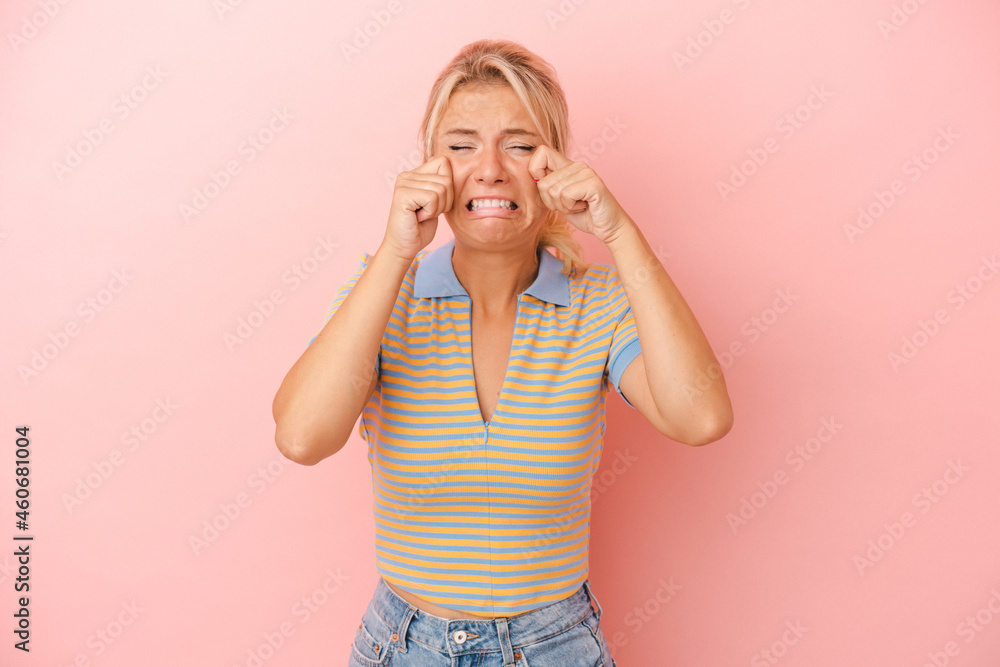 Young Russian woman isolated on pink background whining and crying disconsolately. Young Russian woman isolated on pink background whining and crying disconsolately.
