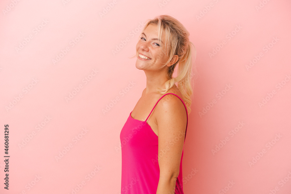 Young Russian woman isolated on pink background confident keeping hands on hips. Young Russian woman isolated on pink background confident keeping hands on hips.