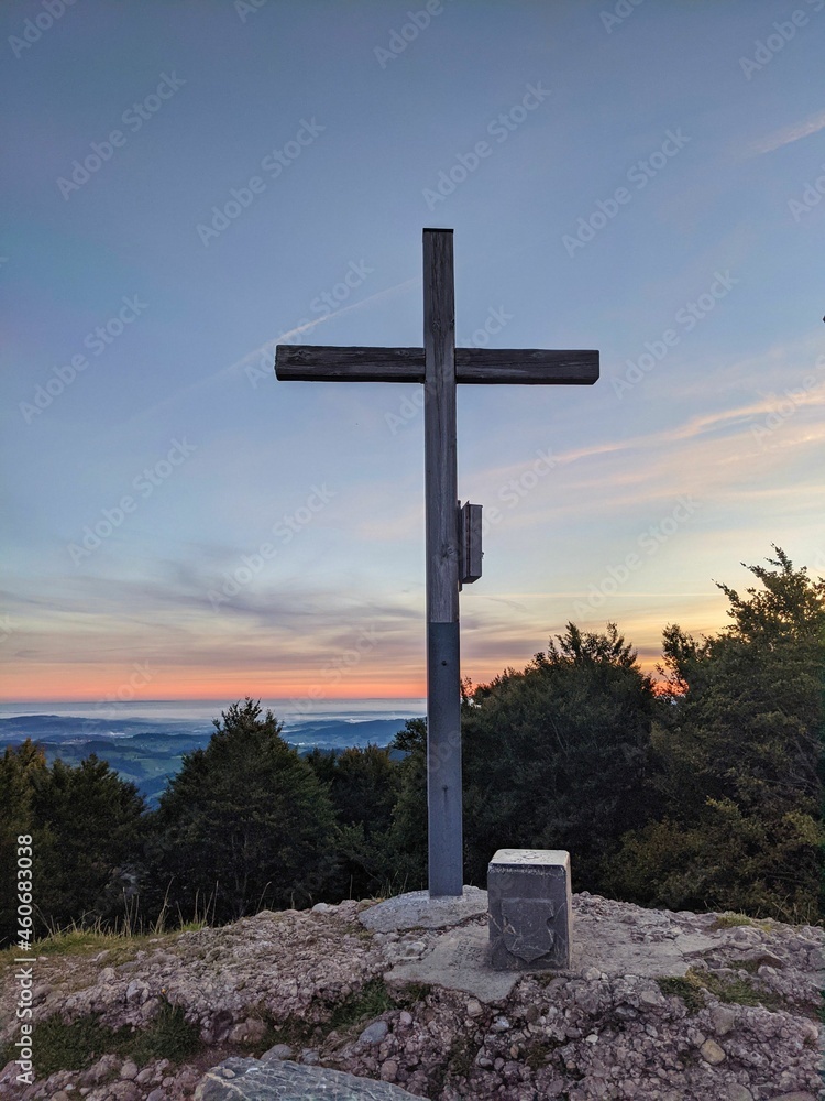 Summit cross on the schnebelhorn in the zurich oberland. Autumn sunrise. Great hiking area in Switzerland. Hill, sun Summit cross on the schnebelhorn in the zurich oberland. Autumn sunrise. Great hiking area in Switzerland. Hill, sun