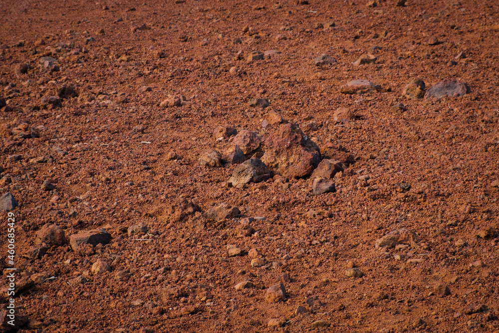red sand and volcanic stones, Canary Island soil closeup - red sand and volcanic stones, Canary Island soil closeup -