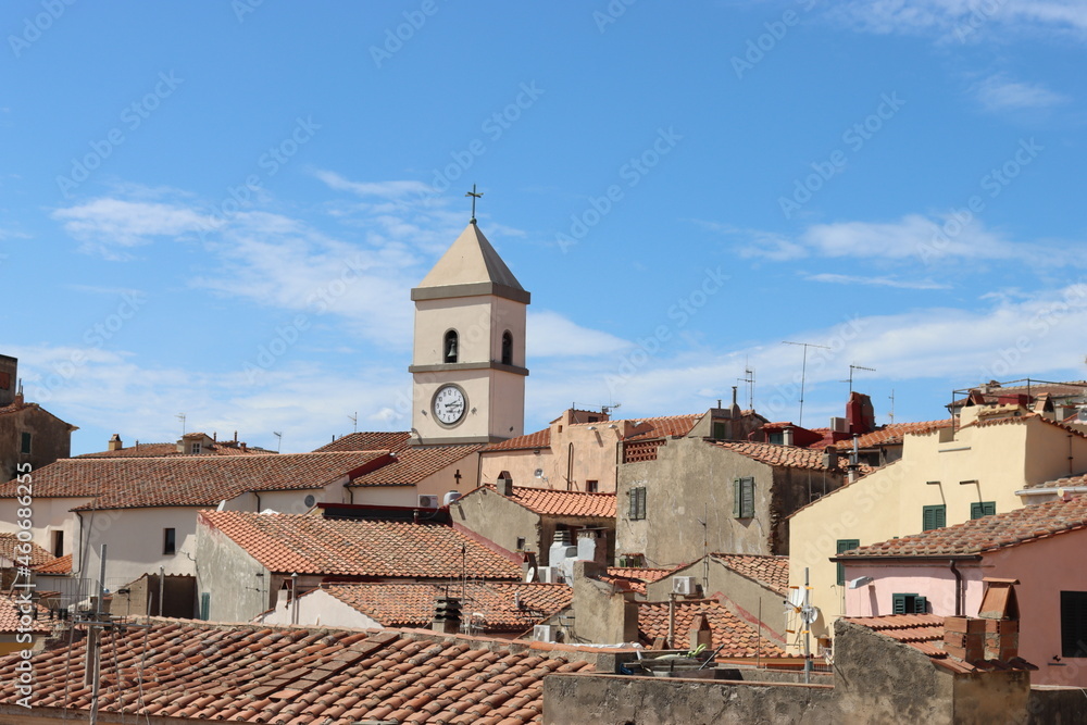 Elba, Italy – September 02, 2021: beautiful places from Elba Island. Aerial  view to the island. Little famous villages near the beaches. Summer tourist places. Clouds and blue sky in the background.