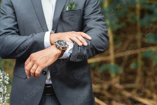 Groom Details awaiting his bride anxiously watching the time pass on his luxury watch