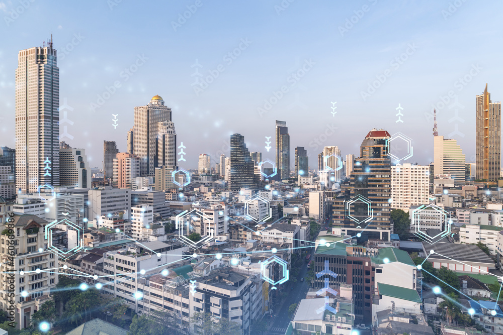 Obraz premium Technology hologram over panorama city view of Bangkok. The largest tech hub in Southeast Asia. The concept of developing coding and high-tech science. Double exposure.