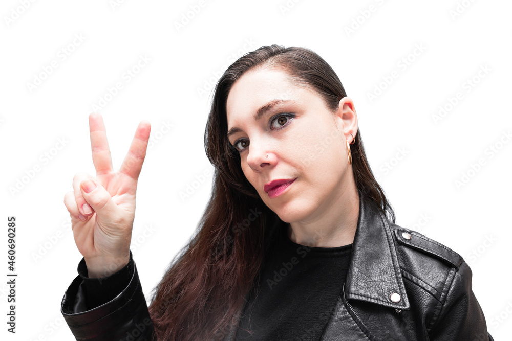 Girl in black biker jacket with loose hair showing victory gesture, heavy metal style, isolated on white background Girl in black biker jacket with loose hair showing victory gesture, heavy metal style, isolated on white background