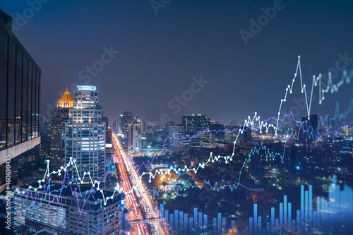 FOREX graph hologram  aerial night panoramic cityscape of Bangkok  the developed location for stock market researchers in Southeast Asia. The concept of fundamental analysis. Double exposure.