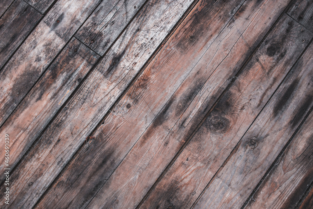 Old wooden floor with diagonal planks. Background, texture Old wooden floor with diagonal planks. Background, texture