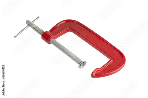 Foto Red clamp on a white background. Joiner's clamp close-up.