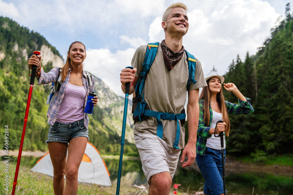 Adventure, travel, tourism, hike and people concept. Group of happy friends with backpack outdoors Adventure, travel, tourism, hike and people concept. Group of happy friends with backpack outdoors