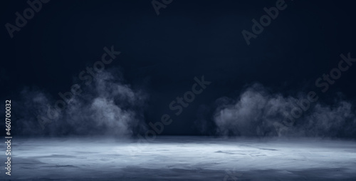 Gray textured concrete platform, podium or table with smoke in the dark photo