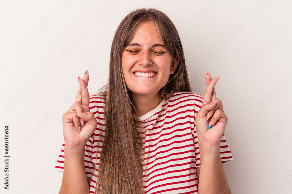 Young caucasian woman isolated on white background crossing fingers for having luck Young caucasian woman isolated on white background crossing fingers for having luck