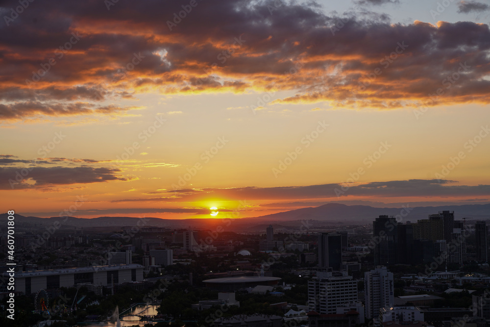 yellow and orange clouds at sunset. dramatic sky skyline background 